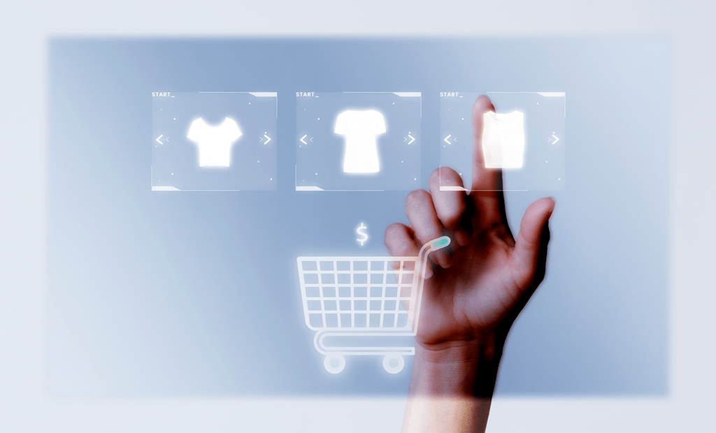 Mão tocando ícones de camisetas e um carrinho de compras holográfico, representando a interação digital e o crescimento do e-commerce.