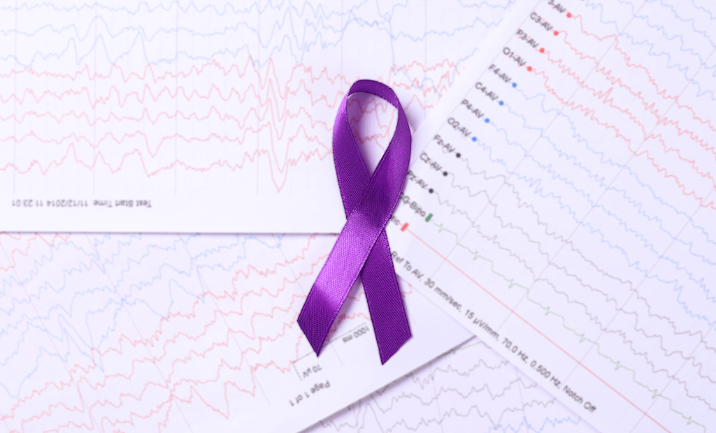 Epilepsia. Imagem de uma fita da cor roxa representando a epilepsia.